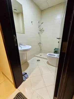 a bathroom with a toilet and a sink at Room with bathroom near beach walk la mer beach Oima leasing property in Dubai
