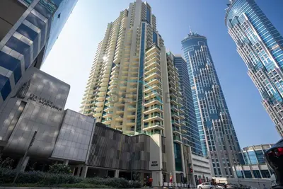 a group of tall buildings in a city at Exclusive Promo Modern 1BR with Partial Canal Views by Deluxe Holiday Homes in Dubai
