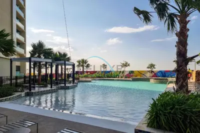 a pool at a resort with a roller coaster at Limited Time Offer Tranquil 1BR in Business Bay by Deluxe Holiday Homes in Dubai