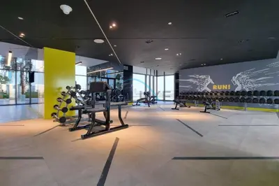 a gym with several rows of bottles of wine at Limited Time Offer Tranquil 1BR in Business Bay by Deluxe Holiday Homes in Dubai