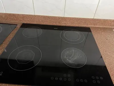 a microwave with three circles on top of it at Opal Tower in Dubai
