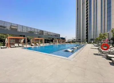 a swimming pool in the middle of a building at Stunning 1BR Apartment High floor Creek Harbour in Dubai