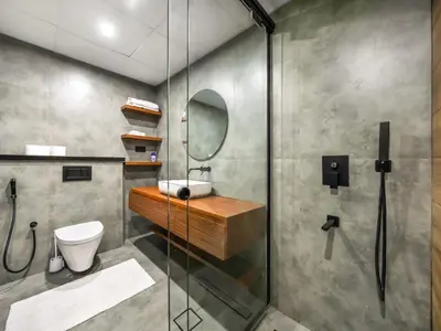 a bathroom with a shower and a toilet and a sink at Luxury 2BR Apartment with Full Marina Views in Dubai
