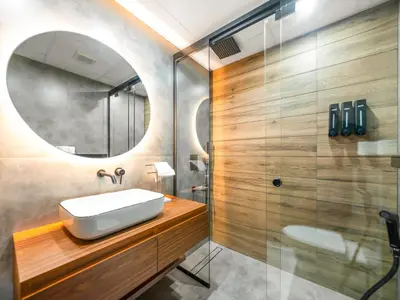 a bathroom with a sink and a mirror at Luxury 2BR Apartment with Full Marina Views in Dubai