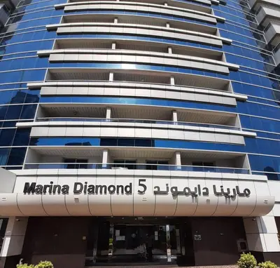 a building with the name of marina diamond global hotel at Luxury 2BR Apartment with Full Marina Views in Dubai