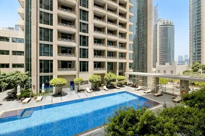 a swimming pool in the middle of a building at Burj KhalifaView Luxury 1-Bedroom Apartment in Dubai