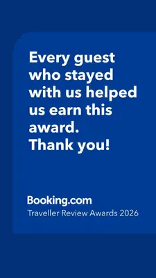 a blue picture with the words every guest who stayed with us helped us earn this at Signature Studio JLT in Dubai