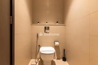 a bathroom with a white toilet in a stall at Downtown Views 1 A Direct Access to Dubai Mall in Dubai