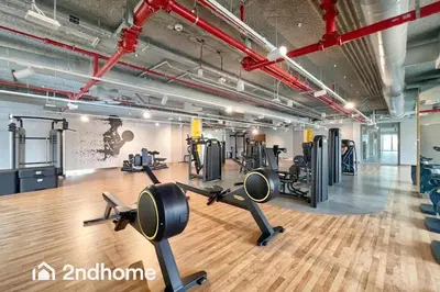 a gym with treadmills and cardio equipment in a building at Downtown Views 1 A Direct Access to Dubai Mall in Dubai