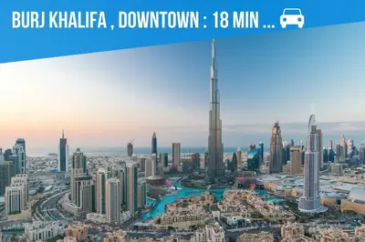 a city skyline with the burj khalifa tower in dubai at Stunning 1 br modern luxury residence at JVC in Dubai