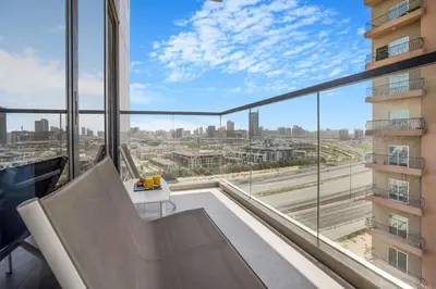 an office with a view of a city at Comfy 1BR w Cinema Room Business Centre Pool Table and Sauna in Dubai