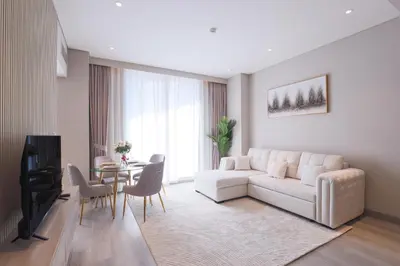 a living room with a white couch and a table at Stunning 1BR in heart of Dubai Marina in Dubai