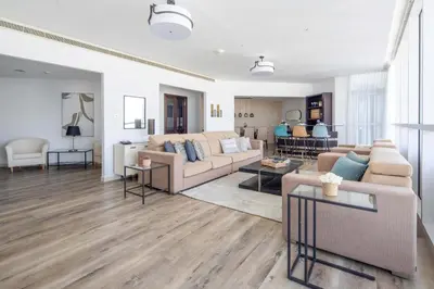 a living room with a couch and a table at Frank Porter - 23 Marina in Dubai