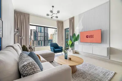 a living room with a couch and a table at GuestReady - Serene Dubai Marina haven in Dubai