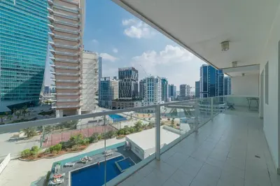 a balcony of a building with a view of a city at Luxurious 1-BR with Balcony & Views Business Bay in Dubai