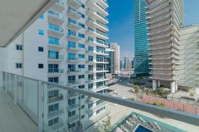 an apartment balcony with a view of a city at Luxurious 1-BR with Balcony & Views Business Bay in Dubai