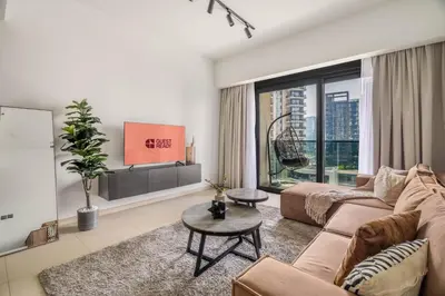 a living room with a couch and a table at GuestReady - Charming retreat in Downtown Dubai in Dubai