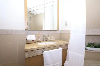 a bathroom with a sink and a mirror at Lux 2 Bed in Downtown Dubai w Dubai Mall Access in Dubai