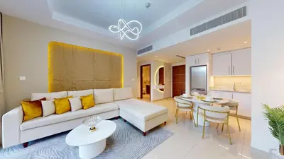 a living room with a couch and a table at Boulevard Point - One Bed with Burj Khalifa View in Dubai