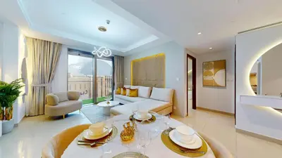 a living room with a couch and a table at Boulevard Point - One Bed with Burj Khalifa View in Dubai