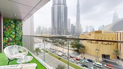 a balcony with a view of a city with traffic at Boulevard Point - One Bed with Burj Khalifa View in Dubai