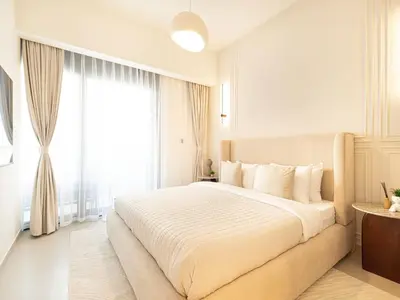 a bedroom with a large bed with a large window at Act Tower Suites by Prestige Nest in Dubai