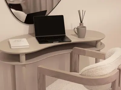 a desk with a laptop on a table with a chair at Act Tower Suites by Prestige Nest in Dubai