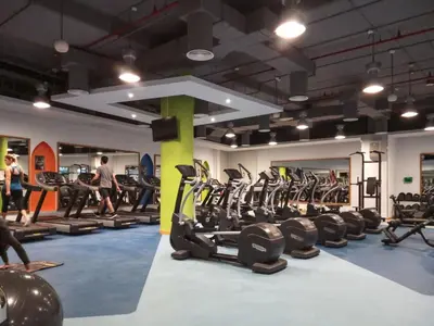 a gym with a bunch of tread machines in it at Frank Porter - Bahar 6 in Dubai