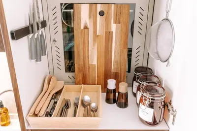 a kitchen counter with a cutting board and utensils at Beachfront Bliss on the Palm Jumeirah in Dubai