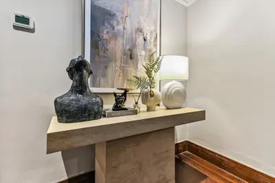 a shelf with a vase and other items on it at Luxury 6BR JBR Penthouse Panoramic Sea Views, Steps to Marina Beach & The Walk in Dubai