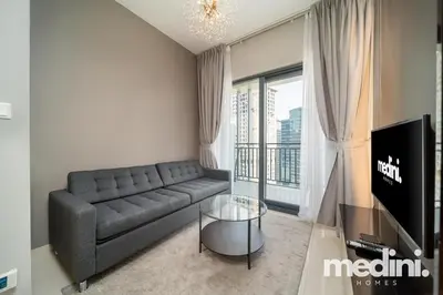a living room with a couch and a glass table at New Listing - Sauna - Gym Pool - Business Bay in Dubai