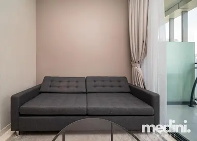 a living room with a couch in a room at New Listing - Sauna - Gym Pool - Business Bay in Dubai