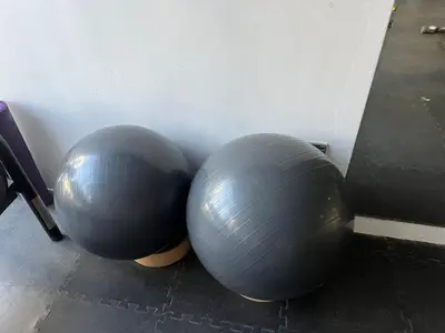two large gray balls sitting next to a wall at Jumeirah Village Circle JVC One bedroom Luxurious Apartment in Dubai