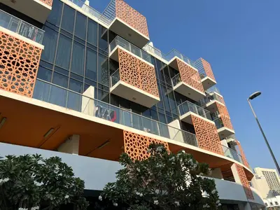 an apartment building with balconies on the side of it at Jumeirah Village Circle JVC One bedroom Luxurious Apartment in Dubai