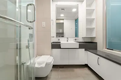 a bathroom with a toilet and a sink and a shower at Silkhaus Beach Access Studio in Palm Views East in Dubai
