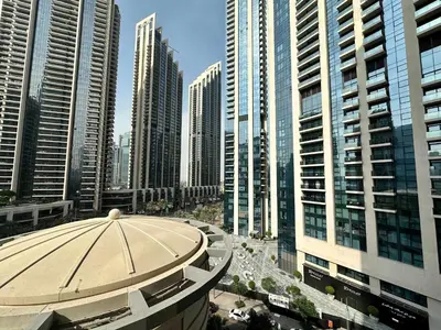a view of a large city with tall buildings at Silkhaus 1BR Downtown Heart in Emaar Tower in Dubai