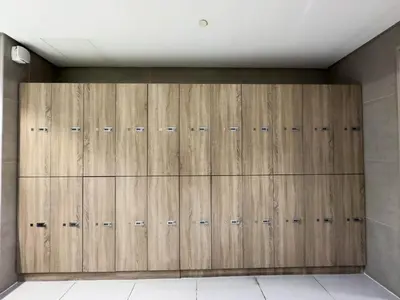 a closet with wooden doors in a room at Chic Marina Vibes 1BR Pad with Epic Views in Dubai