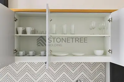 a white cabinet with a sign that reads science building at Cozy 1BR at Collective Tower 1 Near Hills Mall in Dubai