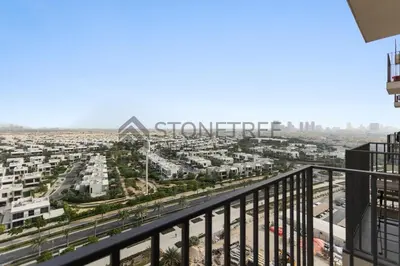 a view of the city from the balcony of a building at Cozy 1BR at Collective Tower 1 Near Hills Mall in Dubai