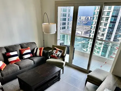 a living room with a couch and a table at Dubai Marina, 2 Bedrooms, apartment, sea view, JBR in Dubai