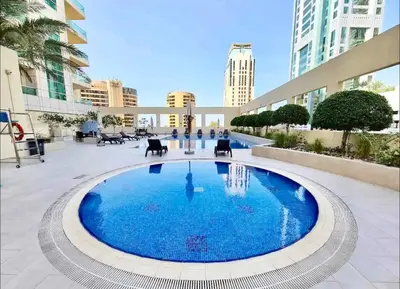 a large pool in the middle of a courtyard at Dubai Marina, 2 Bedrooms, apartment, sea view, JBR in Dubai