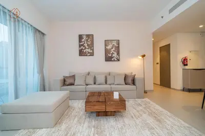 a living room with a couch and a coffee table at Cozy 2-Bed Home with Burj Khalifa Views 204GR-2 in Dubai