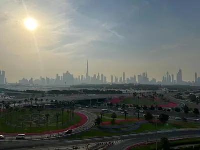 a view of a city skyline with a freeway at Sunset Haven Chic Creek Studio in Dubai