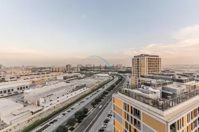an aerial view of a city with a street at Charming 1BR in Dania 3, IMPZ by Deluxe Holiday Homes in Dubai