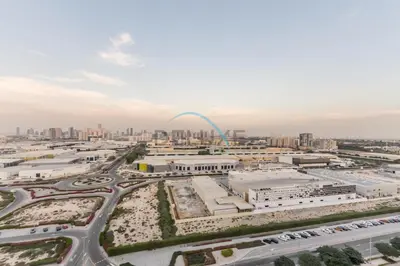 an aerial view of a city with the gateway arch at Charming 1BR in Dania 3, IMPZ by Deluxe Holiday Homes in Dubai