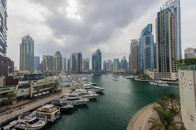 a group of boats docked in a river in a city at Sea View, Easy Access, Close to All Amenities in Dubai