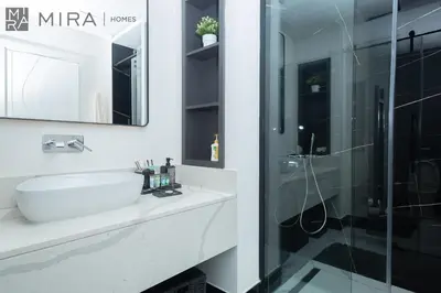 a bathroom with a sink and a shower at Mira Holiday Homes - Newly 2 bedroom with balcony in Business Bay in Dubai