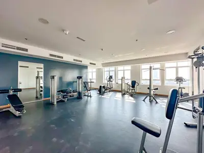 a gym with a lot of chairs in a room at Amazing 2 Bedroom in Al Rabia Tower in Majan 6PPL in Dubai