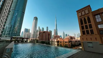 a large swimming pool on the roof of a building at Full Burj Khalifa View, TOP Floor, 5min Dubai Mall in Dubai