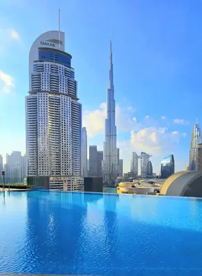 a view of a city skyline with a large building at Full Burj Khalifa & Fountain Views Attached to Dubai Mall in Dubai